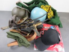 A quantity of militaria inc; helmets, Sa
