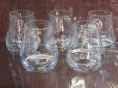 A set of five Glen Livet whiskey tumblers.