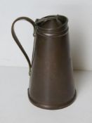 A copper thermos type glass having enamelled lining having indistinct label within and maker's