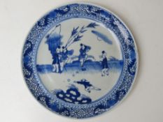 A blue and white Oriental pattern dish, approx 22cm dia.