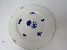 An antique white ground plate having blue floral design upon featuring insect and butterfly,