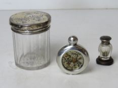 A miniature HM silver and tortoiseshell perfume bottle standing on a hard wood base, total height 5.