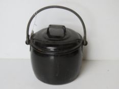 A black enamel Judge Ware fireplace lidded pot with swing handle over.