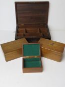 Four assorted wooden decorative boxes.