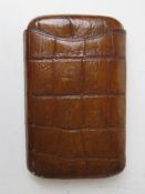 A crocodile skin leather cigar case together with a State Express cigarette silver plated box.