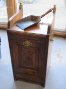 A perdonium coal scuttle with associated shovel having brass drop handles with crest upon and