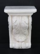 A contemporary plaster wall plinth in the classical style decorated with acanthus leaf measuring 17.