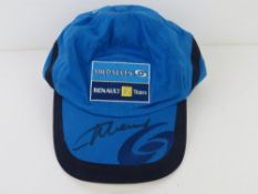A hand signed F1 baseball cap, signature unknown.