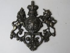 A cast metal heraldic plaque approx 22cm wide.