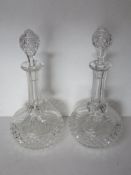 A pair of cut glass decanters each standing approx 31cm high.