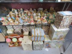A vast collection of Enesco Cherished Teddies figurines, various boxed and unboxed.