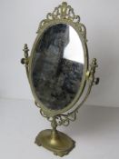 A brass framed dressing table mirror standing approx 50cm high.