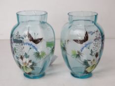 A delightful pair of pale blue glass hand painted vases,