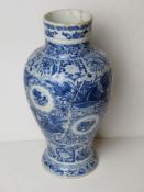 An Oriental blue and white vase, a/f, having been naively restored.