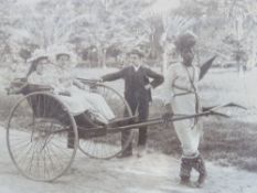 Two vintage photographs, one being of two ladies in cart pulled by black servant,
