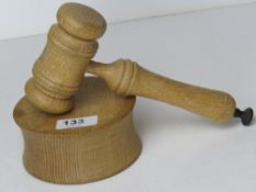 A wooden gavel and block.