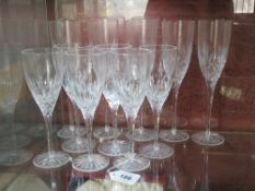 A set of five Doulton International cut glass champagne flutes,