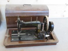 A vintage sewing machine in case Frister & Rossmann Berlin. Inlaid with Mother of Pearl.