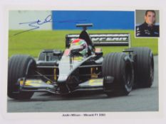 A hand signed photo card of Justin Wilson.