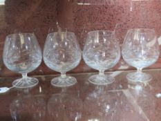 A set of four lead crystal brandy balloons.