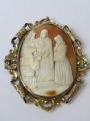 A large and impressive carved shell cameo brooch having biblical type scene upon, measuring 7.5 x 6.
