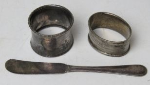 Two HM silver napkin rings together with a Sterling silver butter knife, 54.7g / 1.77ozt.