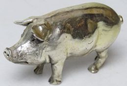A HM silver figurine of a pig (filled), hallmarked for London 1994, 9cm in length.