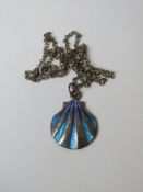 A silver pendant on chain having blue enamel and in the form of a clam shell.