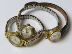 A 9ct gold ladies cocktail watch by Slava together with two other vintage cocktail watches.
