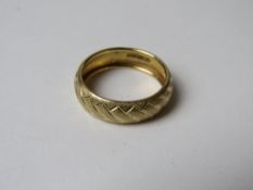 A 14ct gold ring, the band having engraved pattern throughout and stamped 14k, size P, 1.7g.