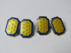 A pair of gold plated and enamelled silver cufflinks having Fleur de Lys pattern upon.