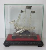 A white metal Chinese Dhow model ship having presentation inscription for 1993,