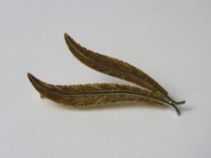 An 18ct gold brooch in the form of two leaves, stamped 750, 3.7g.