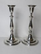 A pair of HM silver tall candlesticks,