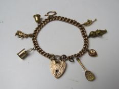 A 9ct rose gold charm bracelet having heart padlock clasp stamp 9ct gold and further stamped 375 to