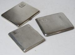Three HM silver cigarette cases,
