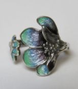 A silver enamelled floral ring in the Art Nouveau style, stamped 925 with further indistinct marks,
