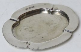A HM silver calling card tray of quatrefoil form,