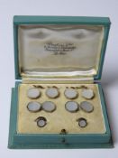 An Art Deco 18ct and 9ct gold suite of men's jewellery in original fitted box comprising cufflinks,