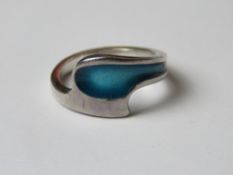 A silver and enamel ring having London Import hallmark upon, other marks indistinct, size K.