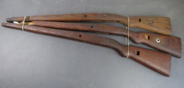Three K98 wooden stocks.