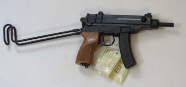 A deactivated Czech Skorpion Wz61 7.65mm sub machine gun with slotted wooden grip.