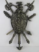 A metal militaria themed wall shield.