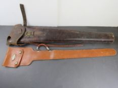 Two leather gun cases. One marked for Henderson-Ames Co, Kalamazoo Mich.