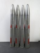 Four 40mm Bofors training rounds on clip.