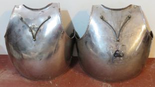 Two decorative reproduction Civil War front armour plates with straps.