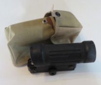 An Elcan 4x reticle scope in US Military pouch.