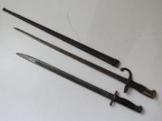 A WWI French Gras bayonet with wooden grips, serial number 6767,