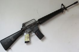 A deactivated US Military Colt manufacture M16A1 5.56mm NATO assault rifle. With detachable bipod.