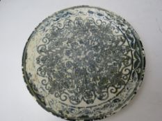 An 'Oriental ivory' plate having blue de